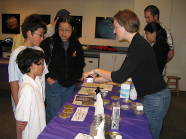 Dr. Bernhardt shows visitors how to test bacterial clearing.